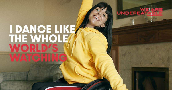 Image of a lady in a wheelchair, with the caption I dance like the whole world is watching