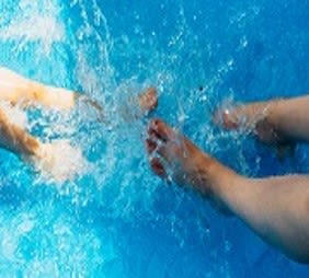 Swimming pool - feet in the water